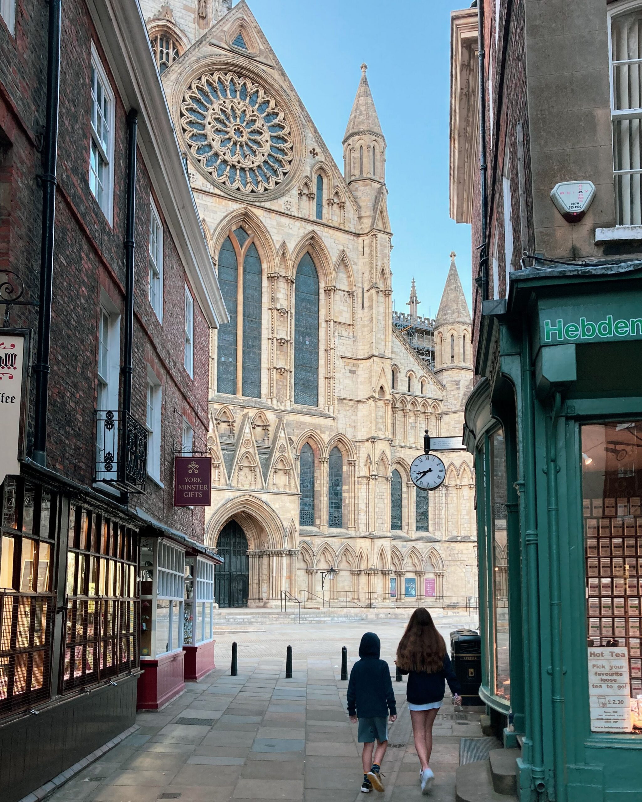Home A street view in York showing pedestrians heading towards the iconic York Minster.